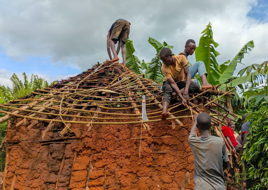 Youth fixing the roof